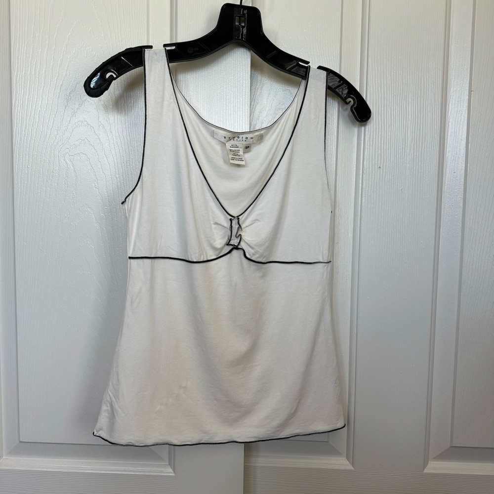 Studio M petite off white cream color top with black trims.